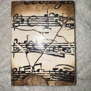 Sid Dickens Memory Block- retired T 10 musical notation